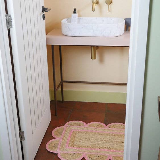 Constance and Denny's Rose scalloped jute floor mat